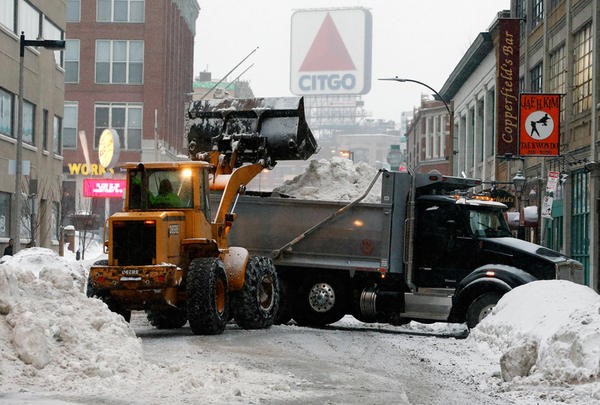 Photo of plow clearing a street