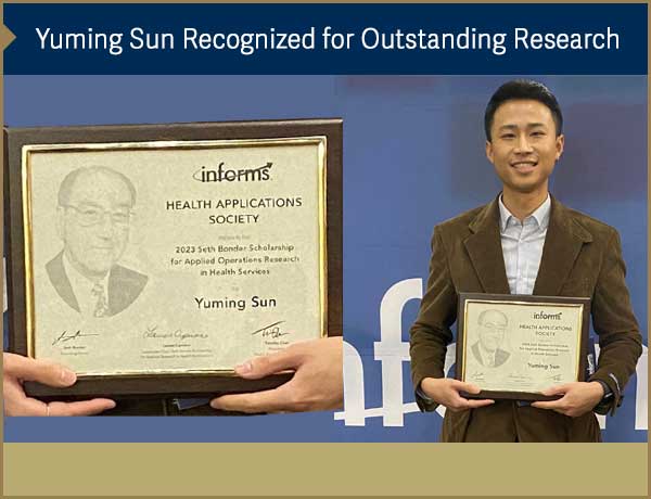 Yuming Sun being presented award plaque